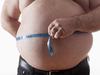 big belly of a fat man and measuring tape isolated on white