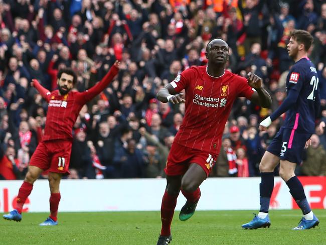 Liverpool's Senegalese striker Sadio Mane celebrates scoring his team's second goal during the English Premier League football match between Liverpool and Bournemouth at Anfield in Liverpool, north west England on March 7, 2020. (Photo by GEOFF CADDICK / AFP) / RESTRICTED TO EDITORIAL USE. No use with unauthorized audio, video, data, fixture lists, club/league logos or 'live' services. Online in-match use limited to 120 images. An additional 40 images may be used in extra time. No video emulation. Social media in-match use limited to 120 images. An additional 40 images may be used in extra time. No use in betting publications, games or single club/league/player publications. /