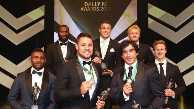 SYDNEY, AUSTRALIA - SEPTEMBER 29: Jarryd Hayne (L) and Johnathan Thurston (R) pose with the team of the year after being presented as joint winners of the Dally M Medal at the Dally M Awards at Star City on September 29, 2014 in Sydney, Australia.