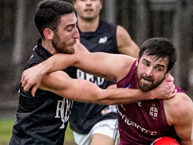 Adelaide Footy League: Prince Alfred Old Collegians FC v Port District Football Club at BundeyÃs Paddock, North Adelaide, Saturday June 19, 2021, PDFC Harrison Hawkins lays a high tackle - pic Mike Burton