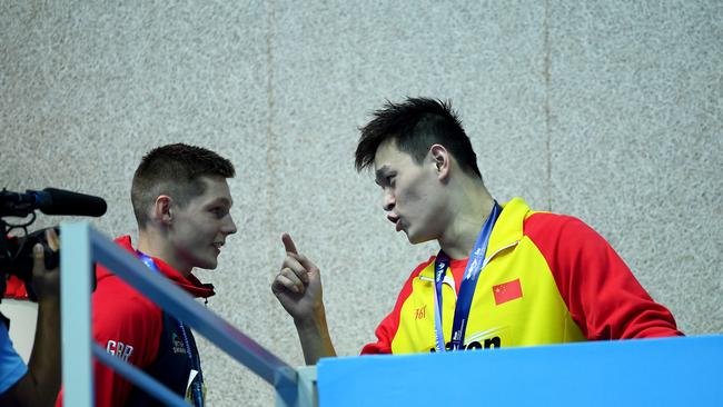 GWANGJU, SOUTH KOREA - JULY 23: Sun Yang (R) of China speaks with Duncan Scott of Great Britain during the medal ceremony for the Men's 200m Freestyle Final on day three of the Gwangju 2019 FINA World Championships at Nambu International Aquatics Centre on July 23, 2019 in Gwangju, South Korea. (Photo by Quinn Rooney/Getty Images)