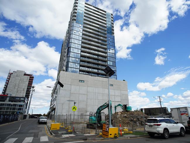 MELBOURNE AUSTRALIA - NewsWire Photos DECEMBER 28, 2024: Photo of Liberty 1 building in Footscray with diggers in the front where Liberty 2 was to be built. Homes under construction hang in balance as Bensons Property Group enters administrationPicture: NewsWire / Luis Enrique Ascui