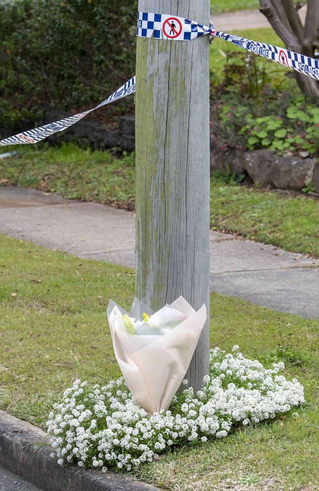 Flowers have been placed across the road. Picture: NewsWire / Simon Bullard.