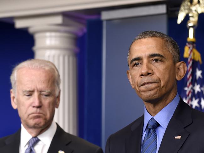 Grim-faced ... President Barack Obama, accompanied by Vice President Joe Biden, pauses while speaking about the church shooting in Charleston. Picture: Susan Walsh/AP