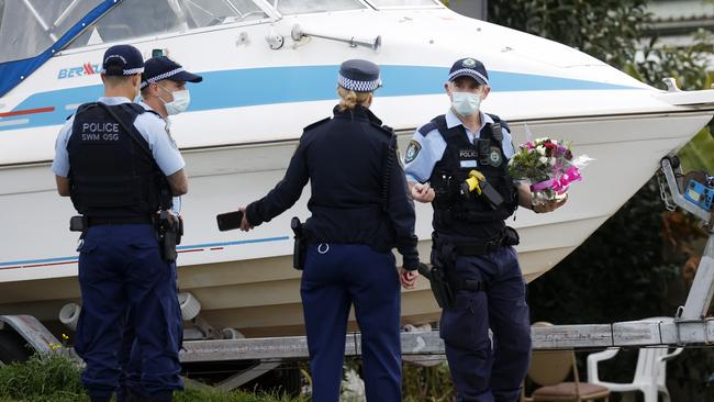 Police at the Pendle Hill home where a woman in her 80s died from Covid-19. Picture: Jonathan Ng