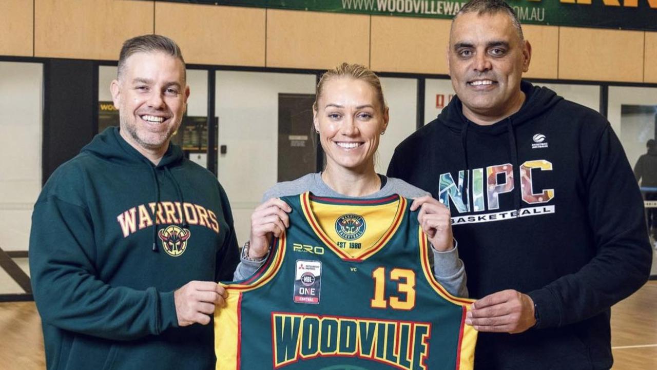 Erin Phillips will return to the basketball court next season after signing with NBL1 Central club Woodville. Phillips poses with president Steve Walker (left) and Warriors legend Paul Vandenbergh at the club. Picture: Woodville Warriors Basketball Club