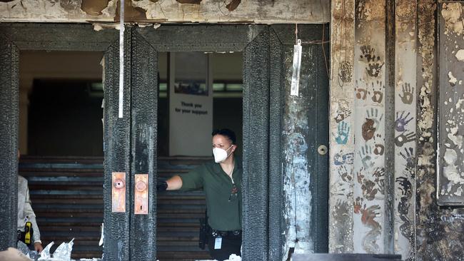 A protest last week led to a fire at Old Parliament House. An Australian Federal Police officer leaves the crime scene. Picture: NCA NewsWire / Gary Ramage