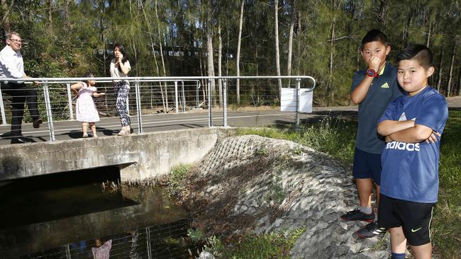 Canada Bay councillor Andrew Ferguson and Amy Chieng with her children Alexia, Leo and Cassius at Black Creek in Concord West. Picture: John Appleyard