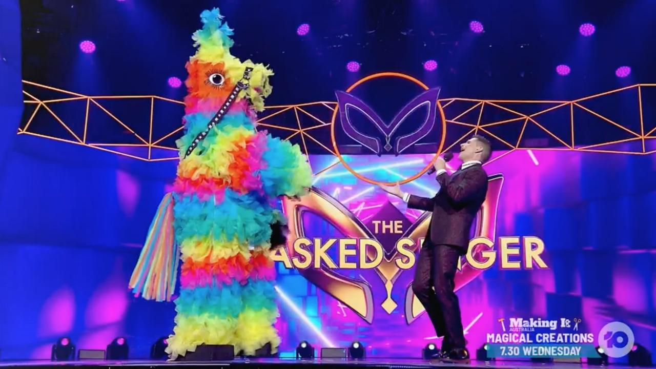 The masked Singer's pinata is revealed.