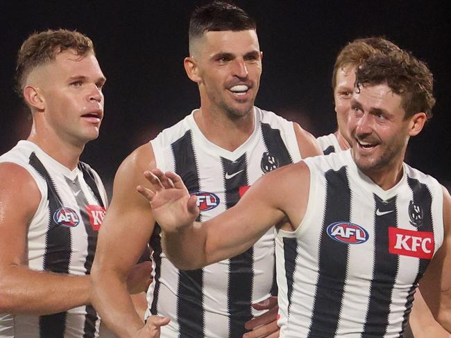 MELBOURNE, AUSTRALIA - FEBRUARY 26: Harry Perryman of the Magpies celebrates with Tim Membrey, Dan Houston and Scott Pendlebury of the Magpies after kicking a goal during the 2025 AAMI AFL Community Series match between Richmond Tigers and Collingwood Magpies at Ikon Park on February 26, 2025 in Melbourne, Australia. (Photo by Daniel Pockett/Getty Images)