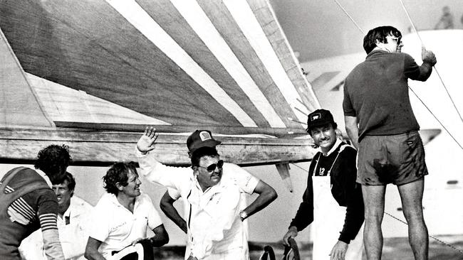 Crew of yacht Australia II (two) including owner Alan Bond &amp; designer Ben Lexen with skipper John Bertrand at helm after winning 1983 America's Cup.