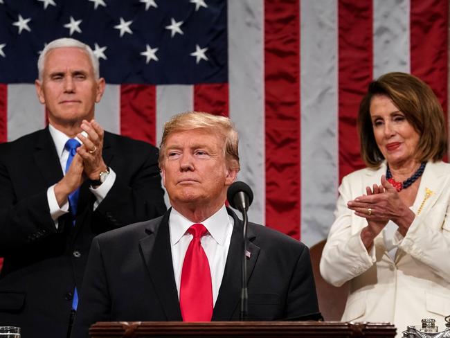 TOPSHOT - US President Donald Trump delivers the State of the Union address, alongside Vice President Mike Pence and Speaker of the House Nancy Pelosi, at the US Capitol in Washington, DC, on February 5, 2019. (Photo by Doug Mills / POOL / AFP)