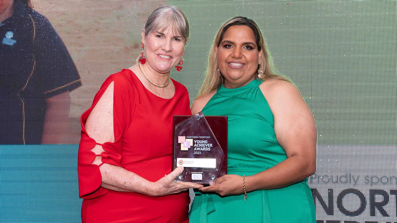 Northern Territory Young Achiever Awards overall winner Leela Kruger (RIGHT) accepts her award from Education Minister Eva Lawler. Picture: Pema Tamang Pakhrin