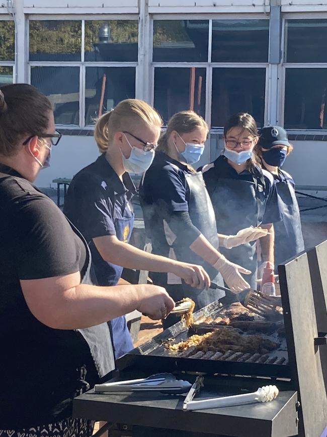 Mount Gambier High School’s democracy sausage barbecqueers in action. Picture: Arj Ganesan