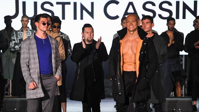 Justin Cassin, pictured with Michael Klim who walked the runway, has been slammed for his “disastrous” show. Picture: James Gourley/Getty Images