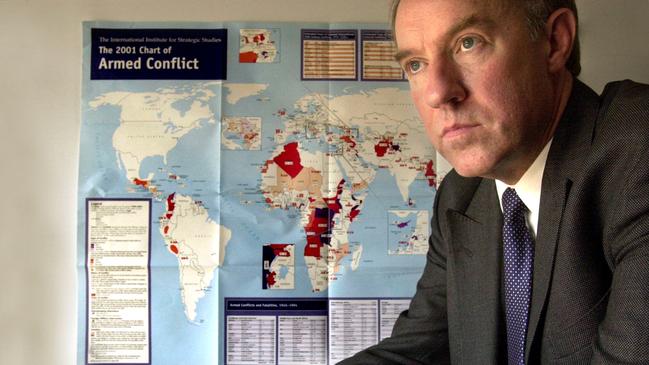 Professor Ross Babbage, in front of a map showing terrorism trouble spots in 2002.