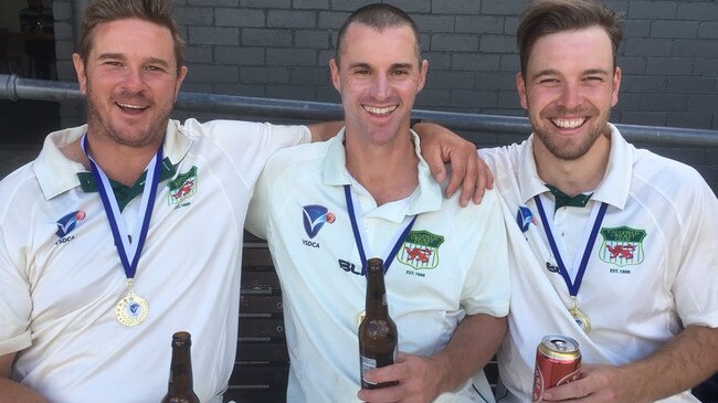 Adam Warren (left) enjoying premiership success with Caulfield teammates Graeme Rummans and Lachie Graf.