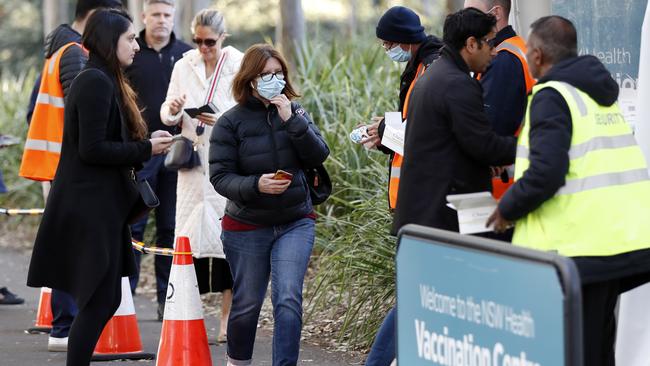 People arriving for their COVID-19 vaccination at the Sydney Olympic Park NSW Health vaccination centre. Yesterday the lines for Pfizer were around 5,000 but Astrazeneca was only about 160. People over 50 are find ways around it to get the Pfizer vaccination. Picture: Jonathan Ng