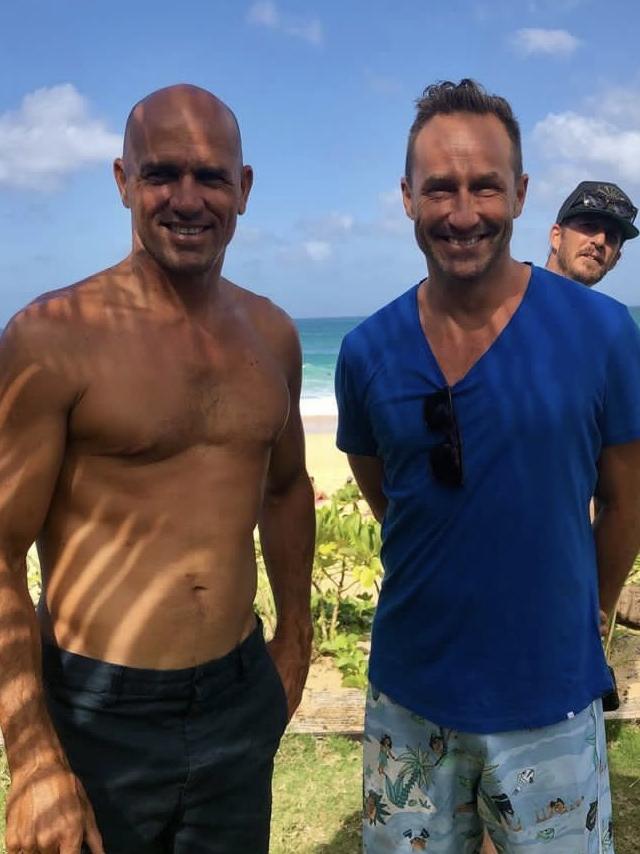 Mr Burbank with surfer Kelly Slater.