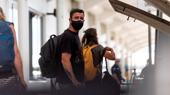 Qantas flight QF838 passengers board buses bound for Howard Springs quarantine facility. Picture: Che Chorley