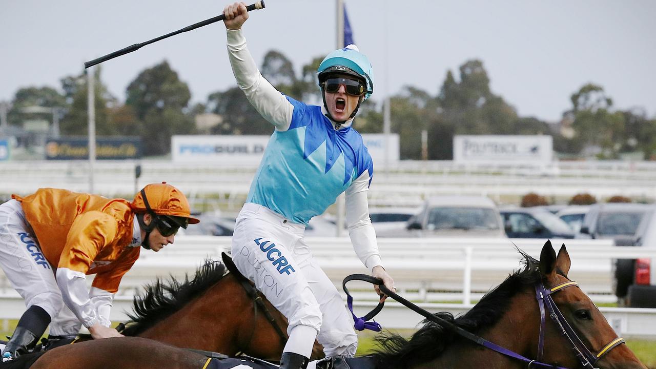 Zac Purton celebrates after winning the Caulfield Cup with Japanese horse Admire Ratki in 2014.