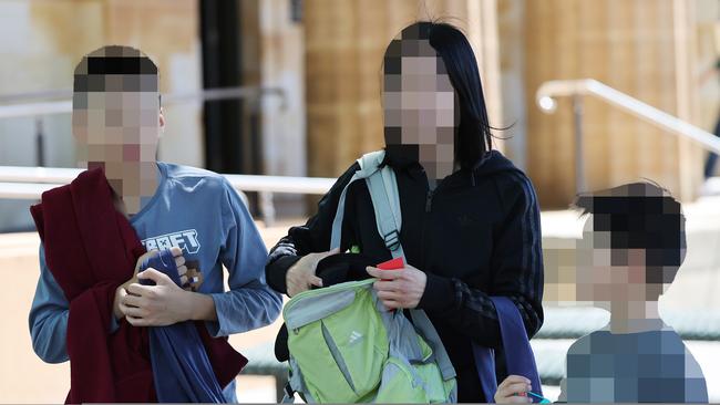 Songnan Bao’s wife (middle) and children leave court after his first hearing. Picture: NCA NewsWire / David Mariuz