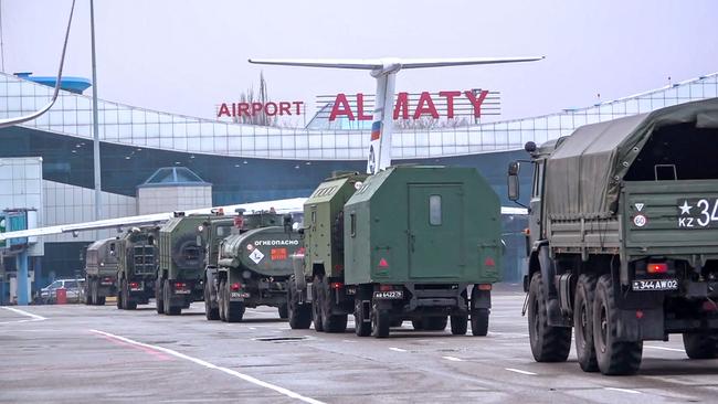 Russian troop trucks rumble off transports on Sunday. Picture: Russian Defence Ministry via AFP