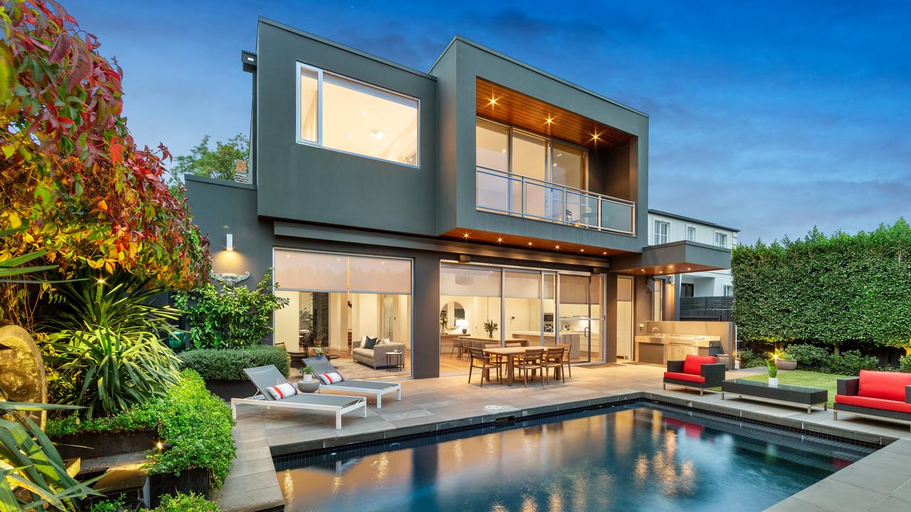 Lush gardens, a saltwater pool and a sunbathing deck make the backyard at 1 Cascade St, Balwyn North one to remember.