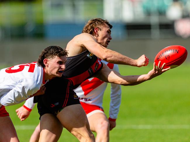 North Launceston’s Josh Rickard handballs during Sunday’s senior preliminary final win over Clarence. Picture: Linda Higginson