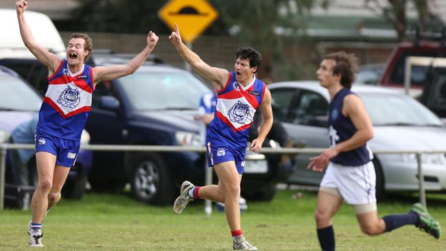 Shane Harvey celebrates a goal for North Heidelberg.