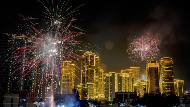 Fireworks explode over skyscrapers during New Year celebrations in Makati, Metro Manila, Philippines. Picture: Getty