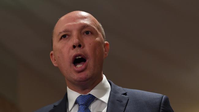 Federal Immigration Minister Peter Dutton speaks to the media about global terrorism prevention in Melbourne, Monday, December 11, 2017. Victoria Police are hosting a three day International Counter Terrorism Forum. (AAP Image/Joe Castro) NO ARCHIVING