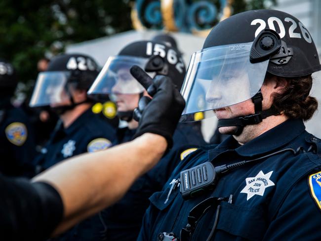 A demonstrator taunts a police officer in San Francisco. Picture: AFP