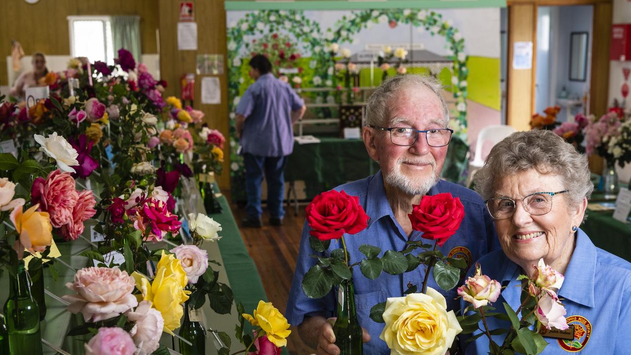 Queensland Rose Society Darling Downs members Doug and Judith Hudson with their roses in the 2022 Spring Champion Rose Show at the Rose Cottage in the Queensland State Rose Garden, Saturday, October 8, 2022. Picture: Kevin Farmer