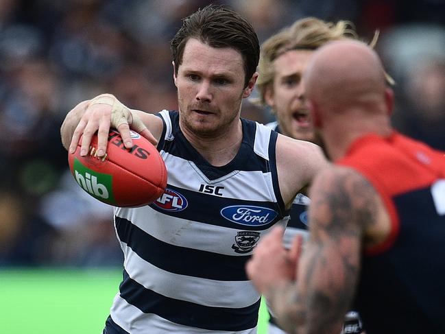 Patrick Dangerfield of the Cats (left) and Nathan Jones of the Demons contest during the Round 23 AFL match between the Geelong Cats and the Melbourne Demons at Simonds Stadium in Geelong, Saturday, Aug. 27, 2016. (AAP Image/Julian Smith) NO ARCHIVING, EDITORIAL USE ONLY