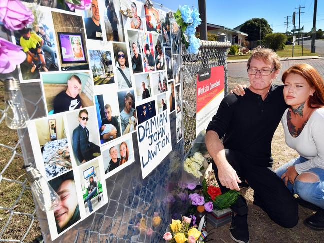 Tribute to Damian Lawton killed in a motorcycle accident – father Ron Lawton and Damian's girlfriend Rayleigh Burke at the crash site on the corner of Woodstock and Neptune Sts in Maryborough. Photo: Alistair Brightman