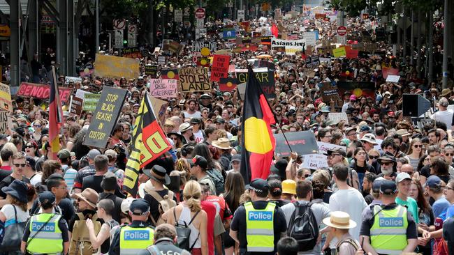 Thousands of protesters attend the Invasion Day march in 2020.