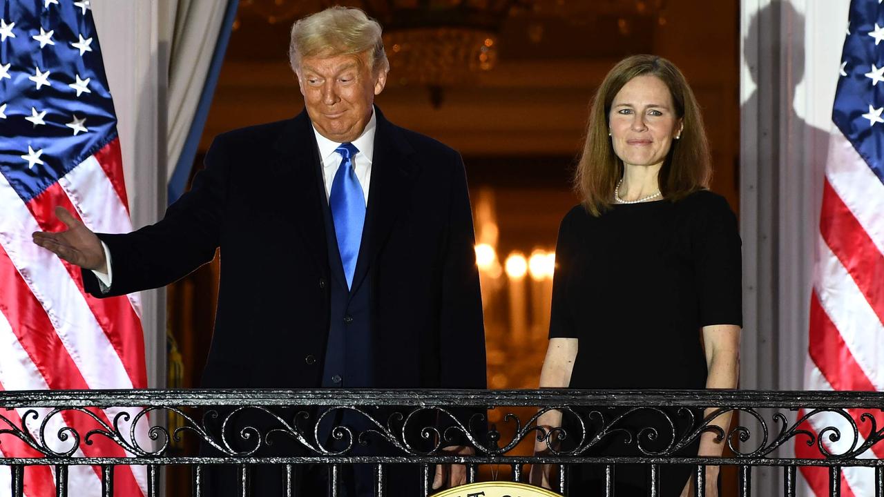 Justice Barrett with Donald Trump at the White House, shortly after being sworn in. Picture: Brendan Smialowski/AFP