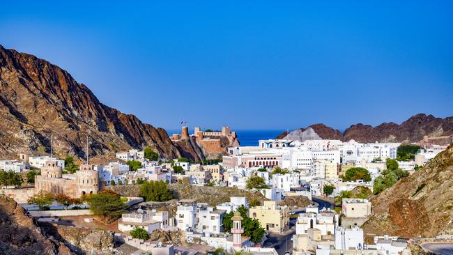 The Al Mirani Fort and the royal palace seen from a distance in Muscat, Oman.