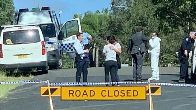 Loved ones embrace at Gilbert Cory Street, where David Steele was stabbed at South West Rocks. Picture: Matt Gazy.