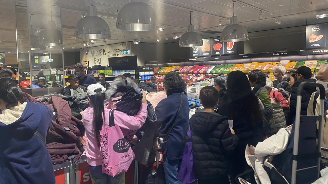 Shoppers worked in teams to grab anything and everything they could. Picture: Vanessa Brown/news.com.au