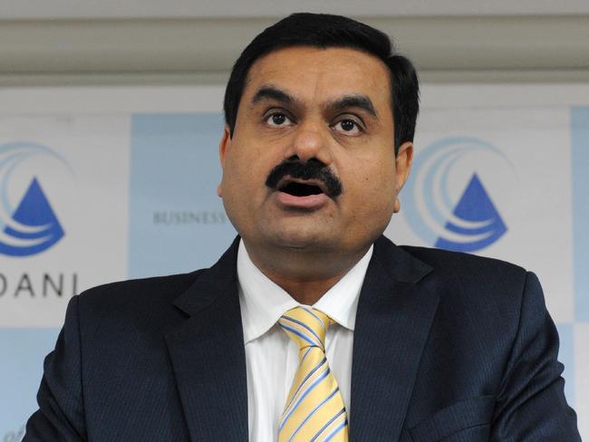 (FILES) This file photo taken on December 23, 2010 shows Chairman of the Adani Group Gautam Adani speaking during a press conference in Ahmedabad. Indian mining giant Adani on June 6, 2017 said it would go ahead with a huge US$16 billion coal project near Australia's Great Barrier Reef that has been widely criticised by environmentalists. / AFP PHOTO / Sam PANTHAKY