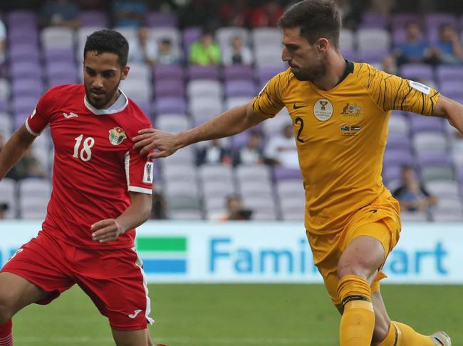 Australia's defender Milos Degenek (R) fights for the ball with Jordan's forward Musa Suleiman during the 2019 AFC Asian Cup football game between Australia and Jordan at the Hazza Bin Zayed stadium in Al-Ain on January 6, 2019. (Photo by KARIM SAHIB / AFP)