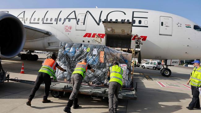 Workers load medical aid to be flown in an Air India aeroplane to India, at Israel's Ben Gurion Airport near Tel Aviv. Picture: AFP