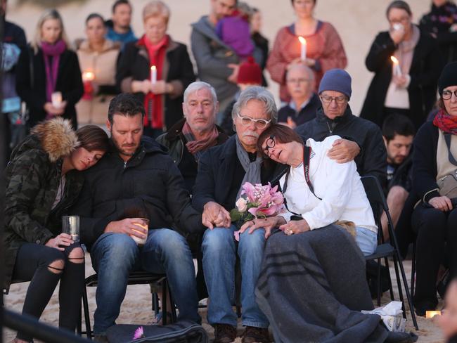 Family and friends join John Ruszczyk and family in a sunrise vigil on Freshwater beach after Justine Ruszczyk Damond was shot by police in Minneapolis. Picture: John Grainger