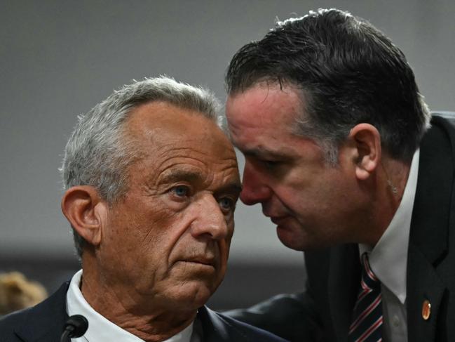 US Secretary of Health and Human Services nominee Robert F. Kennedy Jr speaks with an aide during a Senate Finance Committee hearing. Picture: AFP