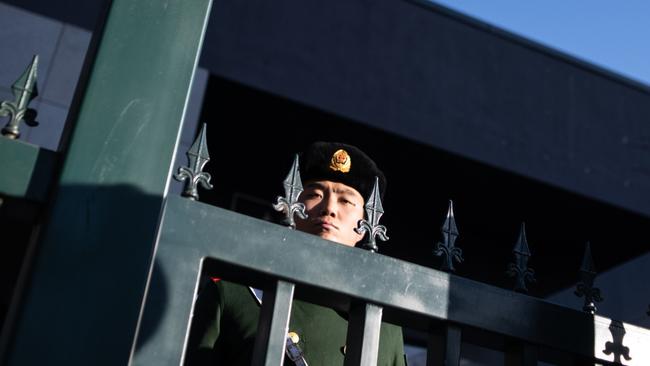 A Chinese paramilitary policeman stands guard at the Australian embassy in Beijing. Picture: AFP