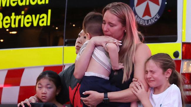 A family leaves the Westfield Bondi Junction shopping mall after a stabbing incident in April. NSW residents had recently experienced the impacts of “online harms” in the wake of such incidents. Picture: David Gray/AFP