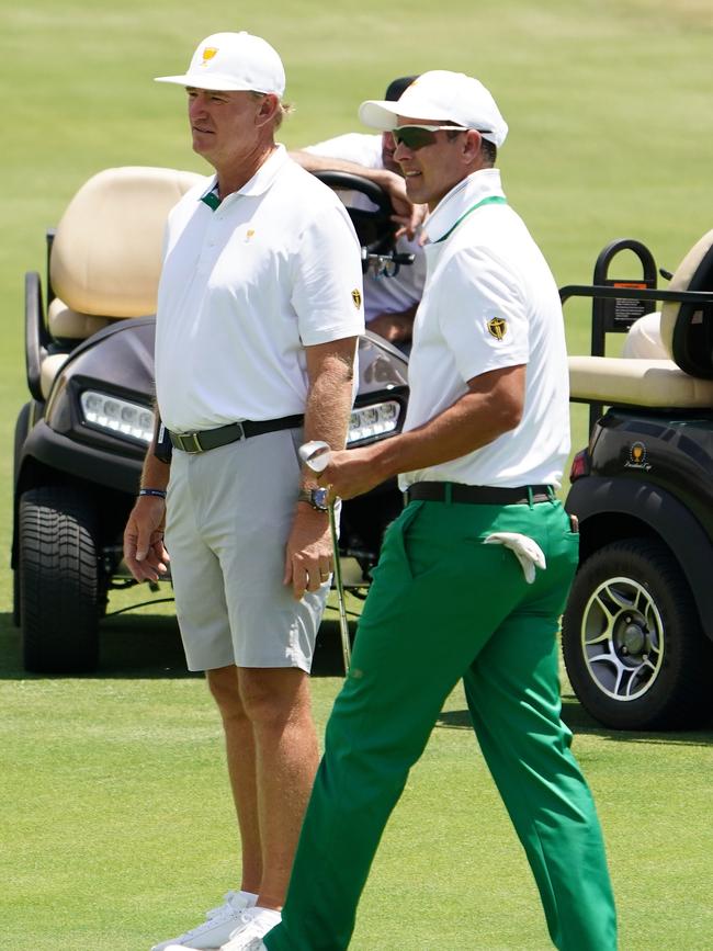 Adam Scott (R) and Ernie Els during a practice round. Picture: AAP/Scott Barbour