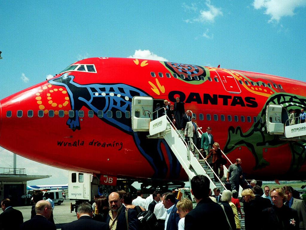 Colourfully decorated with Aboriginal art, a Qantas Boeing 747-400 jet 